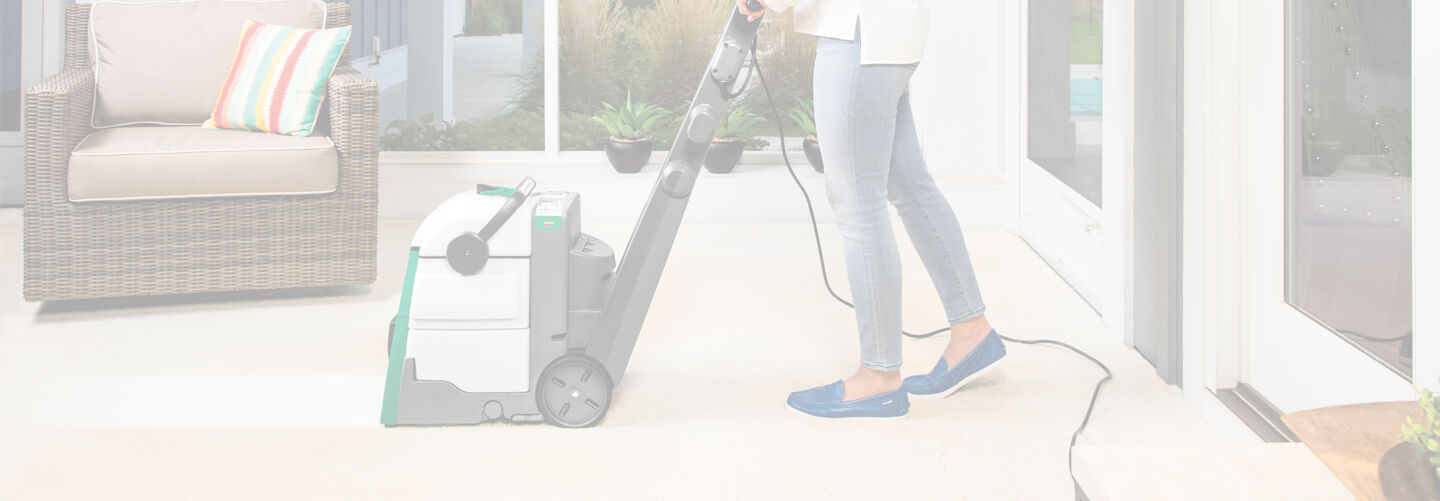 Big Green Machine Carpet Cleaner side view  cleaning high traffic carpet. Text: Best Cleaning System for Pet Messes