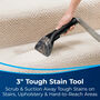 DeepClean Deluxe&trade; Pet Upright Carpet Cleaner Using 3" Tough Stain Tool on stairs. Text: 3" Tough Stain Tool. Scrub &amp; Suction Away Tough Stains on Stairs, Upholstery, &amp; Hard-to-Reach Areas
